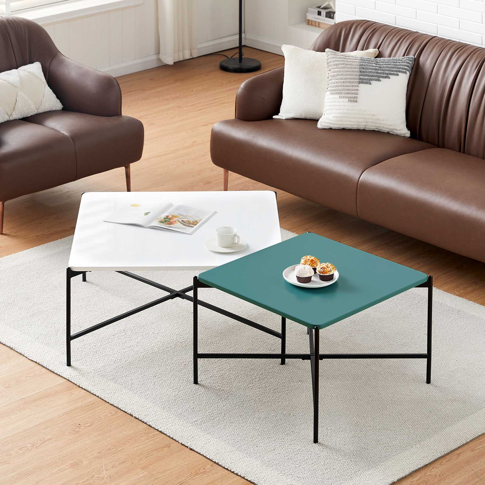 Living room with brown leather sofa, white coffee table, and green side table.