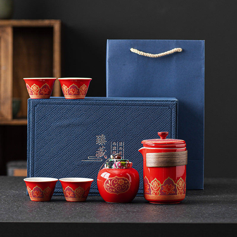 Luxury ceramic tea set gift box with porcelain teapot and matching tea cups in a red presentation case