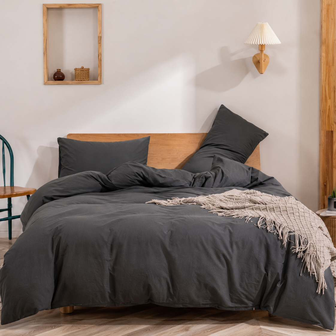 Charcoal grey bedding set styled in a modern minimalist bedroom interior