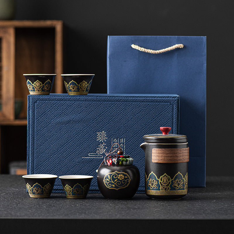 Luxury ceramic tea set gift box with porcelain teapot and matching tea cups in a black presentation case