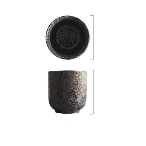 Handcrafted stoneware cup collection featuring textured ceramic glazes in earthy and monochrome finishes
